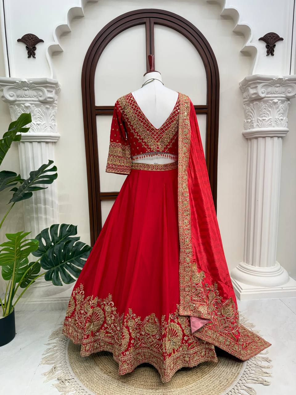 Regal Crimson Red Bridal Lehenga Choli Ensemble Featuring Intricate Gold Zari Embroidery, Heritage Motifs, and Embellished Tassels